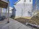Side view of backyard featuring small grass area, and side concrete patio at 5188 Andes Way, Denver, CO 80249