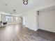 Spacious basement featuring luxury vinyl floors and staircase to upper level at 5188 Andes Way, Denver, CO 80249