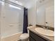 Bathroom featuring shower and tub combination, sink, and vanity at 5188 Andes Way, Denver, CO 80249