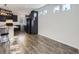 Modern kitchen with dark cabinets, granite countertops, and stainless steel appliances at 5188 Andes Way, Denver, CO 80249