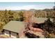 An aerial shot showcasing the home's roof and its stunning mountain backdrop at 11540 Inspiration Rd, Golden, CO 80403