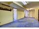 Basement features blue carpet and multiple doorways at 11540 Inspiration Rd, Golden, CO 80403