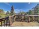 Deck overlooking mature trees, providing a private outdoor space at 11540 Inspiration Rd, Golden, CO 80403