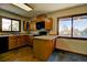 Beautiful kitchen with wood cabinets and view to the outdoors at 11540 Inspiration Rd, Golden, CO 80403