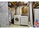 Laundry room with a washer, dryer, and water heater at 11540 Inspiration Rd, Golden, CO 80403