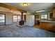 Cozy living room with wood-burning stove and views to kitchen at 11540 Inspiration Rd, Golden, CO 80403