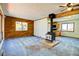 Living room with wood stove and pass through to kitchen at 11540 Inspiration Rd, Golden, CO 80403
