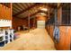 Horse barn interior featuring stalls, storage, and ample space for animal care and equipment at 3530 Doolittle Rd, Monument, CO 80132