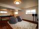Inviting finished basement with beanbag chairs, plush rug, and a covered pool table at 3530 Doolittle Rd, Monument, CO 80132