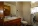 Bathroom features modern fixtures, a vanity, and a toilet with laundry machines at 3530 Doolittle Rd, Monument, CO 80132