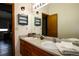 Bathroom vanity with double sinks and a large mirror at 3530 Doolittle Rd, Monument, CO 80132
