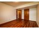 Bedroom featuring hardwood floors and closet doors at 3530 Doolittle Rd, Monument, CO 80132