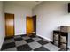 Modern bedroom featuring neutral walls, a checkered floor, and closet storage at 3530 Doolittle Rd, Monument, CO 80132