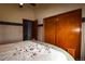 Bedroom showcasing a wooden bed frame with a floral comforter and closet at 3530 Doolittle Rd, Monument, CO 80132