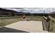 Outdoor deck featuring mountain views and a unique fire pit at 3530 Doolittle Rd, Monument, CO 80132
