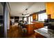 Open-concept kitchen featuring granite countertops, a center island, and modern appliances at 3530 Doolittle Rd, Monument, CO 80132