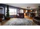 Open-concept living area with view, wood floors, and comfortable seating at 3530 Doolittle Rd, Monument, CO 80132