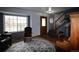 A living room with a wooden staircase, hardwood floors, and a large window for natural light at 3530 Doolittle Rd, Monument, CO 80132