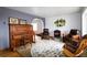 Cozy living room with hardwood floors, a decorative rug, and comfortable seating arrangements at 3530 Doolittle Rd, Monument, CO 80132
