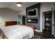 Main bedroom with a fireplace and door to the ensuite bathroom at 3530 Doolittle Rd, Monument, CO 80132