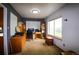 Well-lit home office featuring a wooden desk, ample storage, and a large window at 3530 Doolittle Rd, Monument, CO 80132