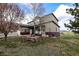 The exterior of a home in a well-manicured lawn with a rock garden and surrounding views at 3530 Doolittle Rd, Monument, CO 80132