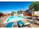 Wide view of the backyard pool, with lots of patio space for entertaining friends and Gathering at 9404 Devils Head Dr, Parker, CO 80138