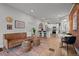 Bright open-concept living room with hardwood floors and modern kitchen access, ideal for entertaining at 3003 California St, Denver, CO 80205