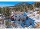 Mountain home with snowy yard and mountain views at 347 Buena Vista, Palmer Lake, CO 80133