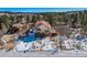 Charming one-story home with greenhouse and snowy landscape at 347 Buena Vista, Palmer Lake, CO 80133