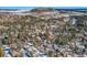 Aerial view of a neighborhood with houses and trees covered in snow at 347 Buena Vista, Palmer Lake, CO 80133