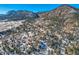 Aerial view of a snowy mountain neighborhood with houses and trees at 347 Buena Vista, Palmer Lake, CO 80133