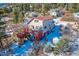 Two-story home with deck and red accents, winter mountain setting at 347 Buena Vista, Palmer Lake, CO 80133