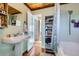 Clean bathroom with shower/tub combo and built-in shelving at 347 Buena Vista, Palmer Lake, CO 80133
