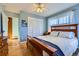 Cozy bedroom featuring wood floors and built-in closet at 347 Buena Vista, Palmer Lake, CO 80133