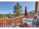 Enjoy mountain views from this deck with seating for relaxing at 347 Buena Vista, Palmer Lake, CO 80133