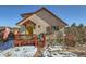 Quaint stucco home with a red deck and colorful accents at 347 Buena Vista, Palmer Lake, CO 80133
