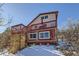 Two-story home with wraparound deck and mountain backdrop at 347 Buena Vista, Palmer Lake, CO 80133
