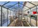 Spacious greenhouse with plenty of room for gardening at 347 Buena Vista, Palmer Lake, CO 80133