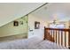 Upper-level hallway with carpeted floors and access to rooms at 347 Buena Vista, Palmer Lake, CO 80133