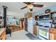 Bright kitchen with white appliances and wood cabinets at 347 Buena Vista, Palmer Lake, CO 80133