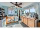 Cozy kitchen with wood cabinets, a wood countertop, and a wood-burning stove at 347 Buena Vista, Palmer Lake, CO 80133