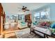 Bright living room with hardwood floors, comfy furniture, and natural light at 347 Buena Vista, Palmer Lake, CO 80133