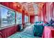 Charming sunroom with string lights and mountain views at 347 Buena Vista, Palmer Lake, CO 80133