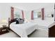 Inviting bedroom featuring a queen bed with decorative pillows and soft, natural light at 3680 S Pontiac Way, Denver, CO 80237