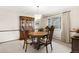 Dining room featuring a wooden table, chairs, a hutch, and a chandelier at 3680 S Pontiac Way, Denver, CO 80237