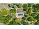 An aerial view shows community pool surrounded by mature landscaping, creating a serene environment at 9255 E Lehigh Ave # 208, Denver, CO 80237