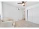Neutral bedroom featuring chair, window and closet at 9255 E Lehigh Ave # 208, Denver, CO 80237