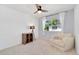 Relaxing bedroom with a comfortable chair, a window, and neutral walls at 9255 E Lehigh Ave # 208, Denver, CO 80237
