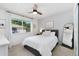 Cozy bedroom with a queen-sized bed, a window, and neutral decor at 9255 E Lehigh Ave # 208, Denver, CO 80237